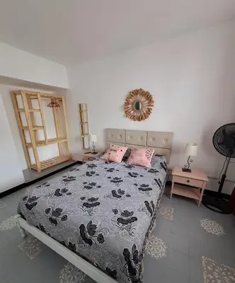 a bedroom with a bed and a mirror on the wall at Achalay in Bialet Massé