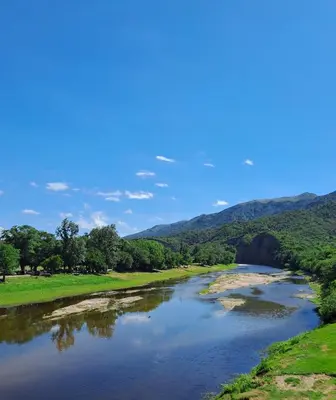 a view of a river with mountains in the background at Achalay in Bialet Massé