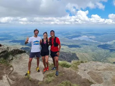 three people standing on top of a mountain at Cabañas Rincon del Champa in San Javier