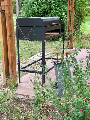 a black grill sitting on top of a patio at Cabañas Rincon del Champa in San Javier