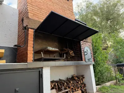 a brick oven with a pile of wood in it at Quincho El Aguaribay in Villa Dolores