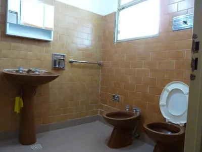 a bathroom with a toilet and a sink at MariaAurelia in Mina Clavero