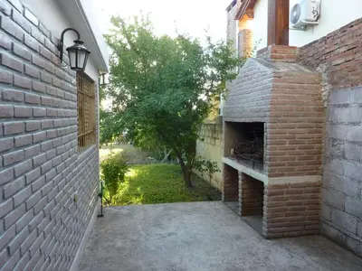 a brick patio with an outdoor oven in a house at MariaAurelia in Mina Clavero