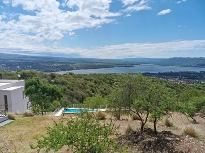 a view of a lake from a house at DEPTO con piscina Climatizada para 6 in Malagueño