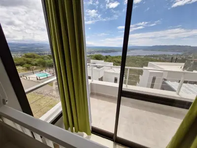 a view from the window of a house at DEPTO con piscina Climatizada para 6 in Malagueño