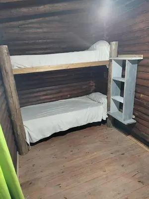 a couple of bunk beds in a room at Cabana Consuelo in San Roque