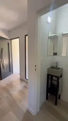 a white room with a sink and a mirror at Sierra y Lago in Villa Parque Siquiman
