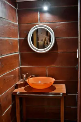 a bathroom with a sink and a mirror on a wall at Villa Armonia in Los Reartes