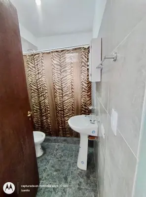 a bathroom with a sink and a toilet at Departamentos Don Luis in Villa Cura Brochero