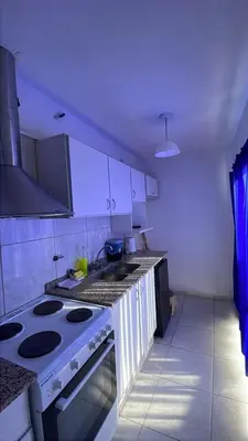 a kitchen with a stove and a stove top oven at Departamento hasta 4 personas Villa Dolores in Villa Dolores