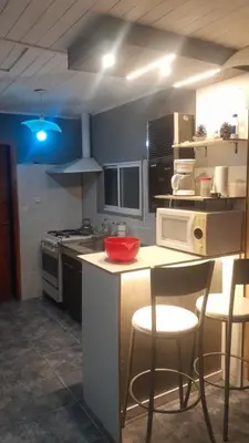 a kitchen with a counter with a red bowl on it at La Loma in Villa del Dique
