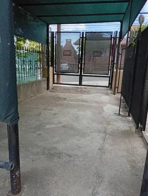 an entrance to a fence with a gate with a gate at La Casita del Tano con Pileta in Villa Carlos Paz