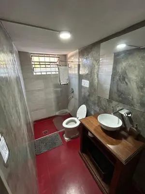 a bathroom with a toilet and a sink and a shower at Casa Henry in Cordoba