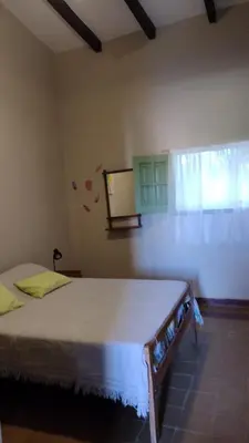 a bedroom with a large bed in a room at La Maguada in Tanti