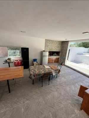 a living room with a bed and a table in it at La Gringa in Tanti