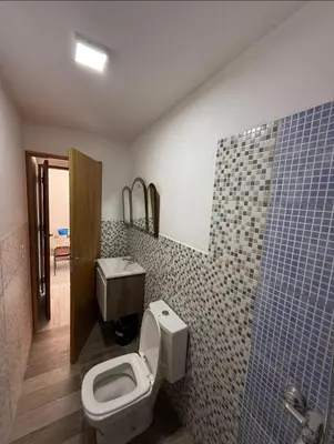a bathroom with a toilet and a sink at La Gringa in Tanti