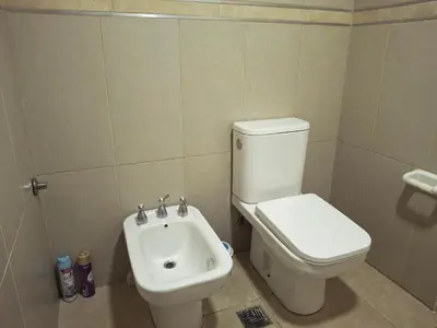 a bathroom with a toilet and a sink at Departamento en Nueva Cordobá, CORDOBA in Cordoba