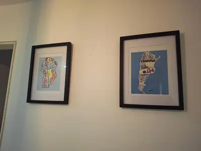three framed pictures hanging on a wall at Departamento en Nueva Cordobá, CORDOBA in Cordoba