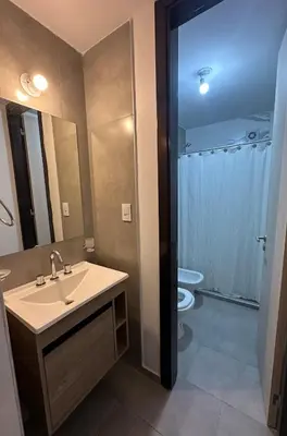 a bathroom with a sink and a toilet at Departamento en el centro de Carlos Paz con pileta in Villa Carlos Paz