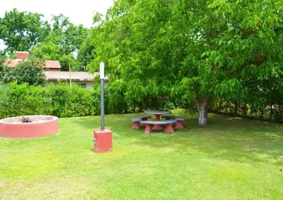 a park with a picnic table and a tree at Rumipaz in Villa Rumipal