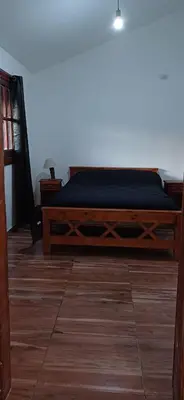 a bedroom with a bed with a blue mattress at Cabaña Benitto in Potrero de Garay