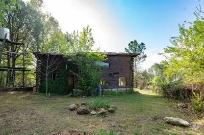 an old brick house in the middle of a yard at Intihuasi Casa del Sol in Atos Pampa