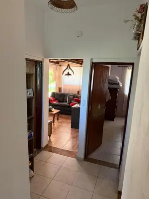 a hallway leading to a living room with a couch at Casa en Cabalango in Cavalango