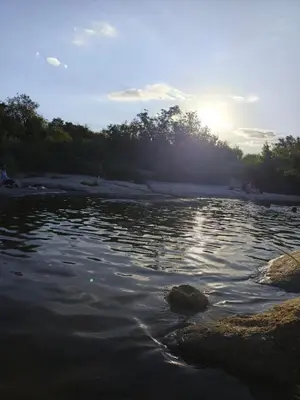 a body of water with the sun in the background at Casa en Cabalango in Cavalango