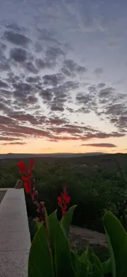 a view of a sunset from the top of a mountain at Casa en Cabalango in Cavalango