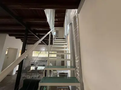 a staircase in a building with green risers at Gea in Las Chacras (La Paz)