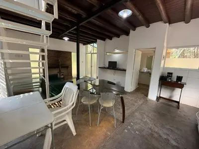 a dining room with a table and chairs in a room at Gea in Las Chacras (La Paz)