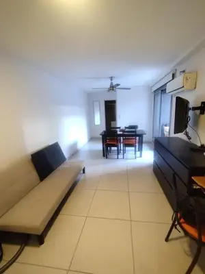 a living room with a couch and a table at Confort en Barrio General Paz in Cordoba