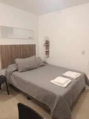 a bedroom with a bed with two towels on it at departamento amoblado en Nueva cba-a metros de la terminal omnibus in Cordoba