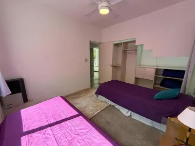 a bedroom with two beds and a ceiling fan at Poseidon in Las Chacras (La Paz)