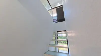 a staircase in a house with a window at Demeter in Las Chacras (La Paz)