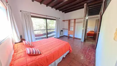 a bedroom with a bed and a large window at Demeter in Las Chacras (La Paz)