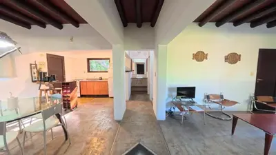 a large living room with a table and chairs at Demeter in Las Chacras (La Paz)