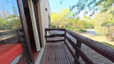 a porch with a bench on a balcony at Demeter in Las Chacras (La Paz)