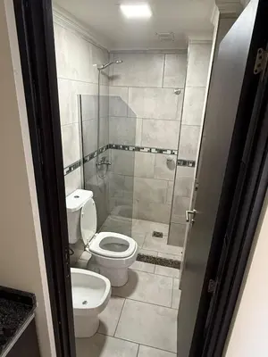 a bathroom with a toilet and a shower at Triplex Premium in Villa Carlos Paz