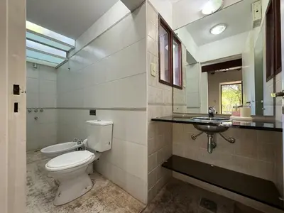 a bathroom with a toilet and a sink at Atlas in Las Chacras (La Paz)