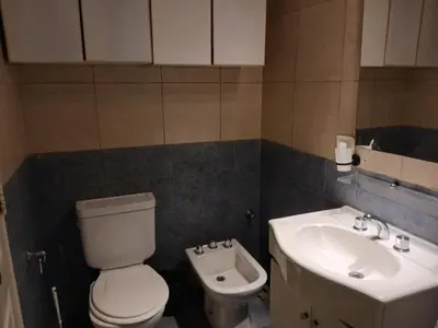 a bathroom with a toilet and a sink at Corazón de nva cba in Cordoba