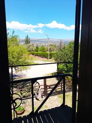 a view from a balcony with a view of a road at Caburé in Mina Clavero