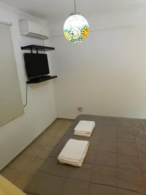 a room with two white towels on a tile floor at Balcones de Alberdi in Cordoba