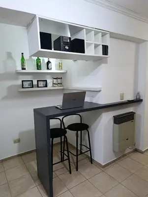 a kitchen with a desk with a laptop on it at Balcones de Alberdi in Cordoba