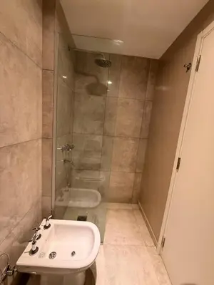 a bathroom with a shower and a sink and a toilet at ALOJATE PREMIUM VILLA CARL0S PAZ - Stefano 2 dor in Villa Carlos Paz