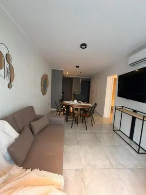 a living room with a couch and a table at ALOJATE PREMIUM VILLA CARL0S PAZ - Stefano 2 dor in Villa Carlos Paz