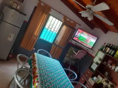 a kitchen with a table and a television in a room at casa en bialet masse in San Roque