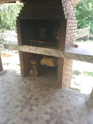 an outdoor brick oven with a brick floor at casa en bialet masse in San Roque