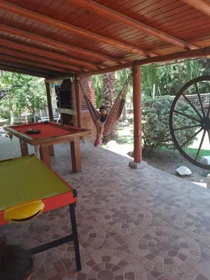 a little girl playing in a hammock in a playground at casa en bialet masse in San Roque