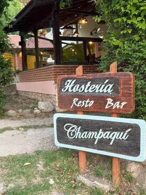 a sign in front of a restaurantaja register bar at Hostería Champaquí in Los Hornillos
